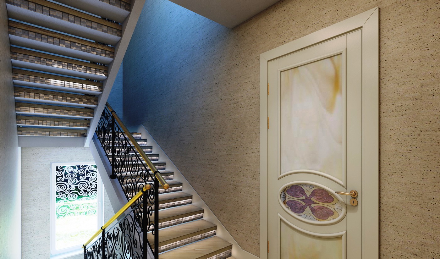 Лестничный пролет в трехэтажном доме Лестничный пролет в трехэтажном доме оформлен в классическом стиле. Перила лестницы изготовлены из кованого металла. 